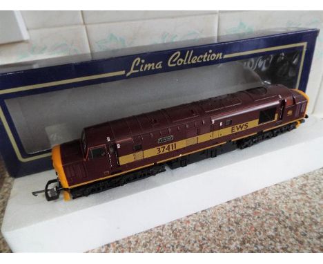 Lima Collection - an OO gauge class 37 diesel electric locomotive EWS marron and yellow livery op no 37411 'Ty Fafan' # L2047