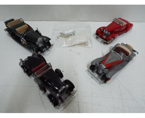 Danbury Mint - Four unboxed 1:24 scale diecast model cars by Danbury Mint. Lot includes 1932 Cadillac V16; 1935 Duesenberg SS