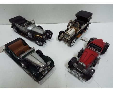 Franklin Mint - Four unboxed 1:24 scale diecast model vehicles from Franklin Mint. Lot includes 1925 Rolls Royce Silver Ghost