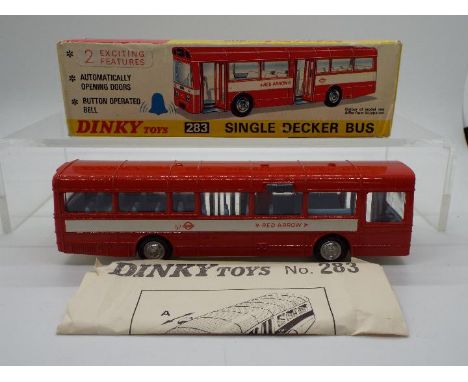 Dinky Toys - A boxed Dinky Toys #283 Single Decker Bus. The model in red with 'Red Arrow' white decals, pale blue interior an