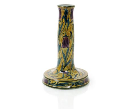 A large Hancock & Sons Morris Ware candlestick designed by George Cartlidge, model no.C20-1, painted with bell flowers in pur