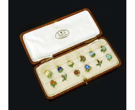 A set of twelve silver and enamel glass markers, retailed by Daniel Todd & Son, Glasgow, each modelled as a single flower ste