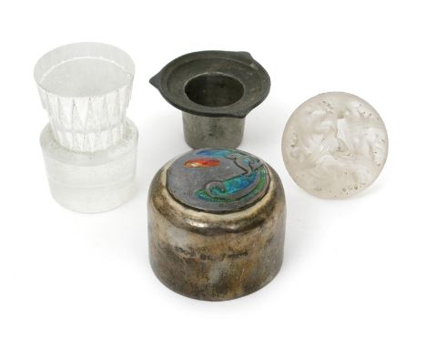 A Liberty & Co Cymric silver and enamel canister cover designed by Archibald Knox, the domed cover set with roundel cast in l