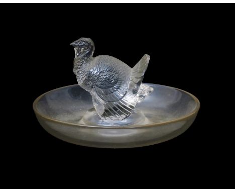 'Dindon' no.287 a Lalique clear glass cendrier designed by Rene Lalique, etched R Lalique, 10.5cm. diam. Catalogue Notes This