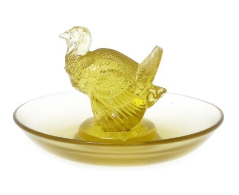 'Dindon' no.287 a Lalique yellow glass cendrier designed by Rene Lalique, etched R Lalique France 10cm. diam. Catalogue Notes