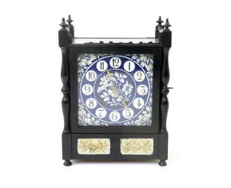 An Aesthetic Movement ebonised wood mantel clock, rectangular form with galleried mantel, set with enamelled porcelain dial p