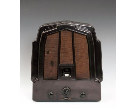 An Ekco M23/RS2 bakelite radio designed by J K White, designed 1932, the brown bakelite Odeon case, applied Ekco label to rev