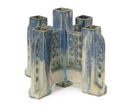 A Charles Greber ceramic bud vase, five square section vase stems on cruciform base with trellis panels, glazed blue graduati