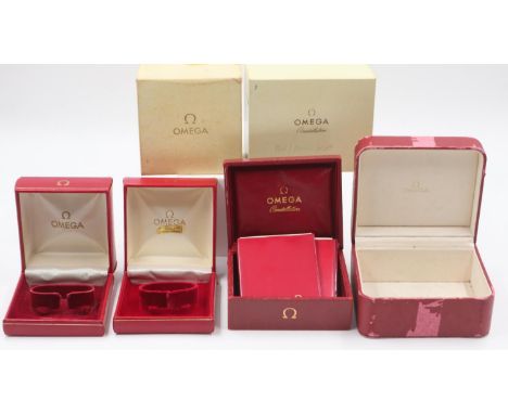 OMEGA: four wristwatch boxes, two with papers and outer-card boxes, mixed conditions. UK P&amp;P Group 2 (£20+VAT for the fir
