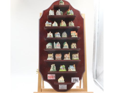 Princeton Gallery 'The Country Cottage' thimble collection, twenty four thimbles in original hardwood wall display stand. UK 