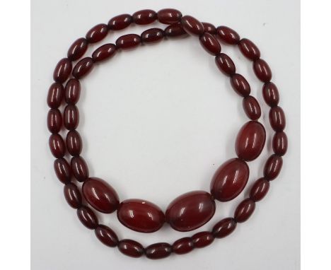 Cherry amber graduated bead necklace, largest bead L: 28 mm, 39g, condition good. UK P&amp;P Group 0 (£6+VAT for the first lo