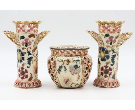 Pair of Zsolnay Pecs reticulated twin handled vases, each H: 17 cm, no cracks or chips, and a matching bowl, crack to rim. UK