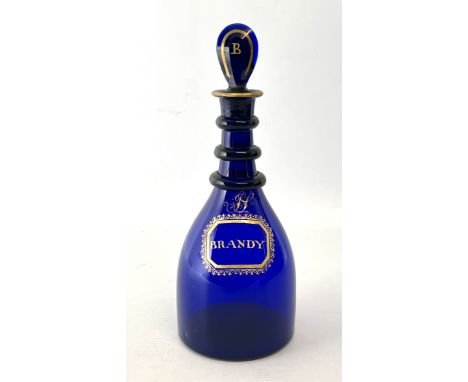 A Georgian Bristol blue and gilt wine label decanter - the mallet shaped decanter with three graduated neck rings and a groun