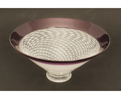 A latticino glass bowl by Michael James Hunter of Twists Glass Studio, Selkirk - the conical bowl with a spiral of white comb