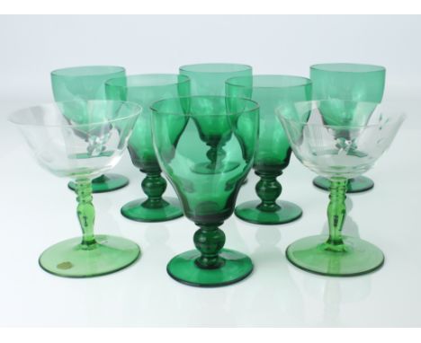 A set of six green glass wine glasses, early 20th century - the ogee bowls on ball knopped stems and plain feet, 11.9cm high;