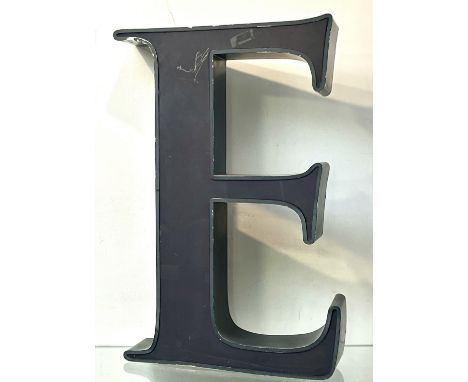 A large letter 'E' sign, probably originally from a shop or venue frontage - second half 20th century, in grey painted steel 