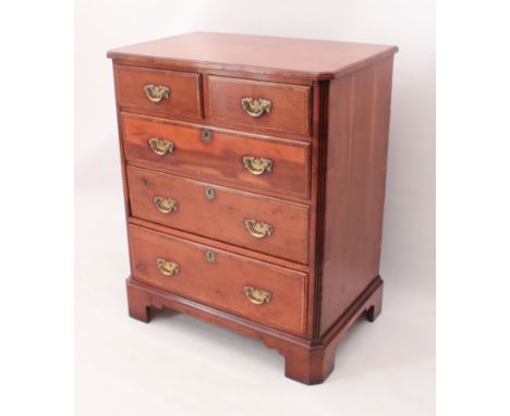 A yew wood TV cabinet in the form of a small Georgian-style chest of drawers - three feather-banded faux drawers with brass f