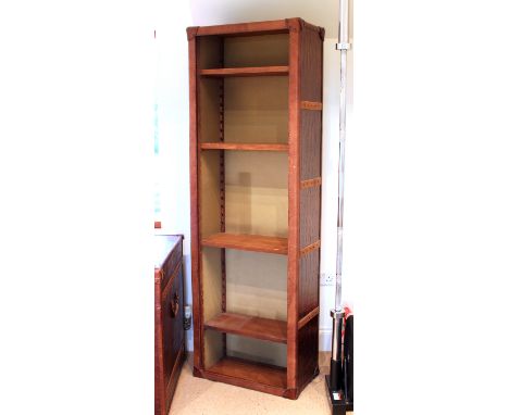 A crocodile leather open bookcase by Halo - (matches lot 671), the tall, narrow bookcase with four adjustable wooden shelves.