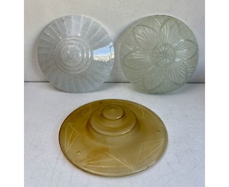 Three French glass plafonniers ceiling lights - 1920s-30s, circular, one in moulded, frosted and cut amber glass; the second 