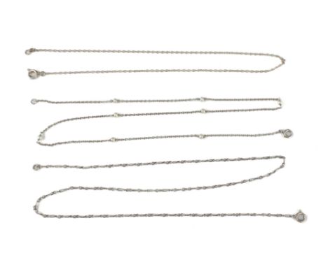 A vintage mid-century white gold and seed pearl necklace - unmarked, tests as 18ct gold, the cable link chain set with eight 