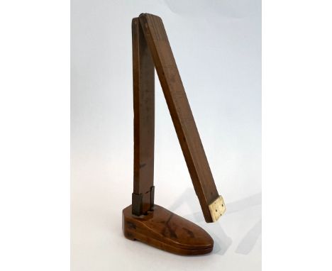 Treen: a fine boxwood folding foot-measure - signed 'W. Harrison - Maker', the brass-mounted and hinged folding rule showing 