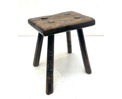 A 19th century elm milking stool - the rectangular seat on four splayed, octagonal section legs, the seat 24.25 x 18.25cm, 28