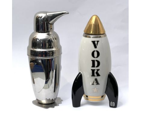 Two novelty cocktail shakers - one by Jonathan Adler, in the form of a space rocket, the gilt nosecone forming the lid, 25cm 