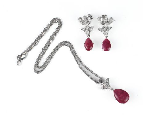 An 18ct white gold, ruby and diamond pendant with matching earrings