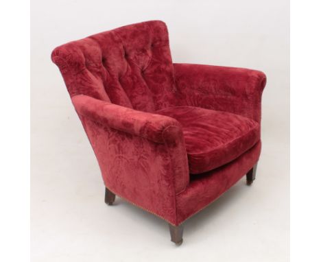 A Victorian button back tub arm chair of generous proportions - with scroll back and arms, raised on square tapered mahogany 