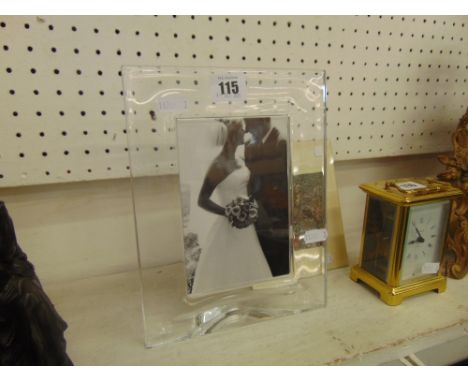 An Orrefors crystal photo frame, 9inches by 7inches