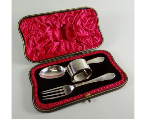 A SILVER CHRISTENING CUTLERY SET comprising spoon, fork and napkin ring, London 1905, 23ozs