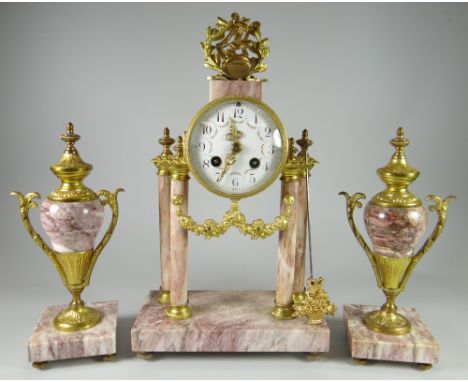 A PINK MARBLE CLOCK GARNITURE SET of Classical architectural form with the drum raised over a platform base with four pillars