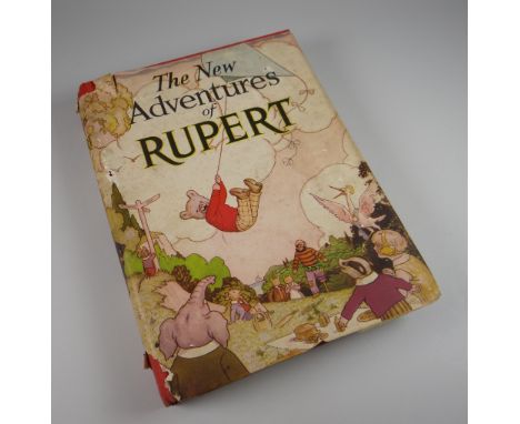 A 1936 FIRST EDITION OF 'THE NEW ADVENTURES OF RUPERT' with dust-jacket, published by Daily Express  Conditon: excellent cons
