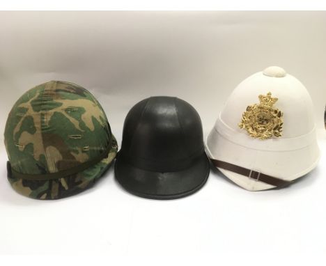 A modern army helmet, pith helmet and a vintage style motorcyclist's helmet (3).