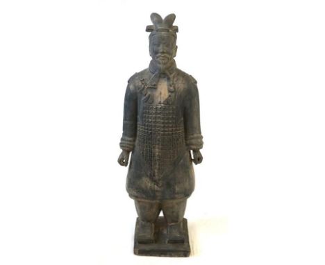 A reconstituted stone or plaster model of a terracotta army warrior, 20th Century 
Modelled as a warrior in full battle armou