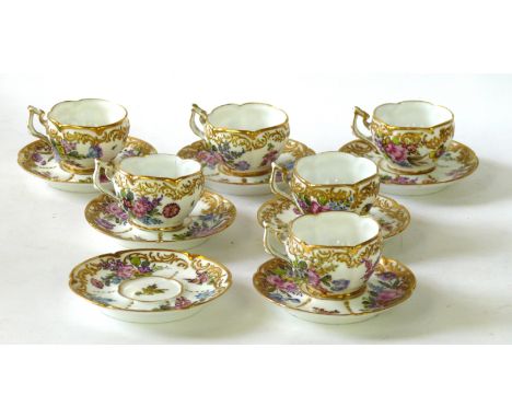 A Meissen style Deutsche Blumen coffee service
Comprising six flower bud form coffee cups with scrolling handles each resting