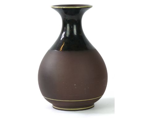 A Wedgwood Chapman & Hall stoneware vase circa 1880
Of bulbous pear form raising to a flared rim the matt glazed body extendi