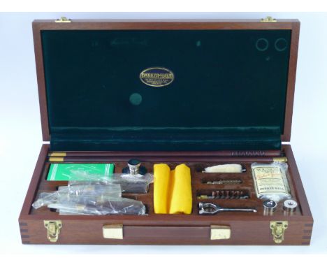 A Parker-Hale cased 12 bore cleaning kit
The wooden case enclosing cleaning rod, oil, cleaning tool, brush, screwdrivers, oil