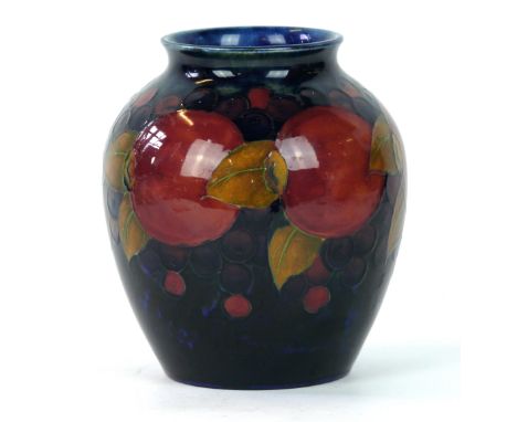 A Moorcroft pottery vase of bulbous form decorated in the pomegranate pattern
On a blue ground, blue signature and impressed 