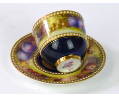 A Royal Worcester fruit painted miniature coffee cup and saucer, painted by John Flexman, dated 1919
The cup and saucer paint