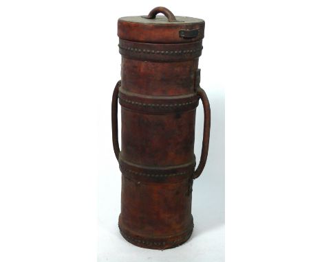 A WWI period leather shot carrier
The main leather body with banding and stud decoration, stamped R.C.D. with broad arrow war