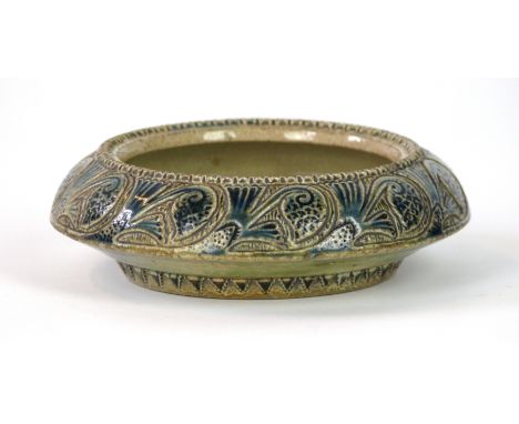 A Martin Brothers ware circular bowl
Having incised floral decoration with cobalt blue highlights, by Robert Wallace Martin, 