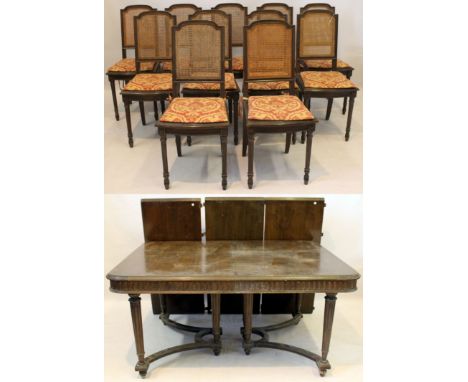 A late Victorian/Edwardian solid oak dining suite of classical form
Comprising a large extending dining table with three extr