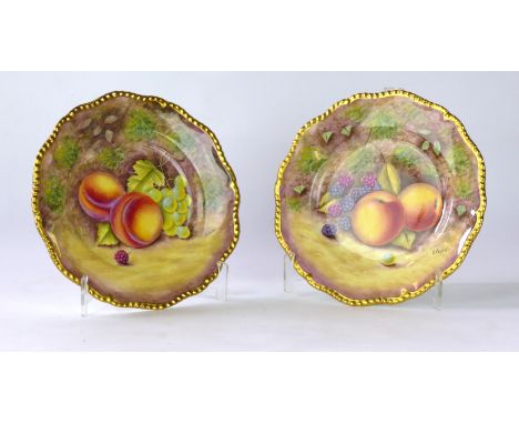 A pair of post war Royal Worcester fruit painted plates, painted by R Price
Each of the circular form plates with gilt gadroo