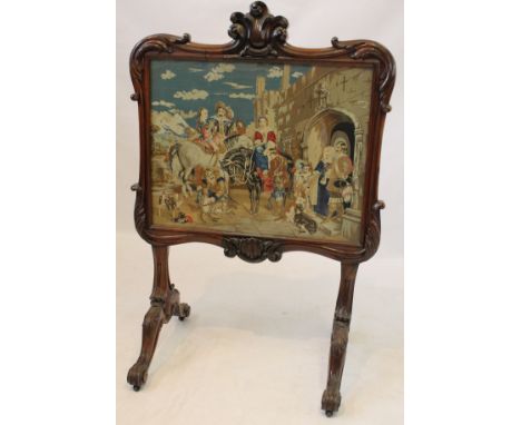 A good quality Victorian carved rosewood fire screen of large elegant proportions
Containing a Victorian wool work pictorial 