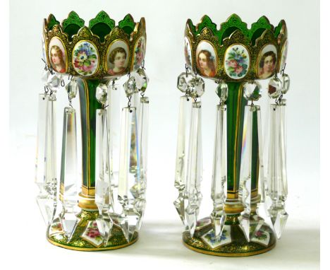 A pair of late 19th Century green glass lustre's
Each mounted on a domed foot, the basal knopped stem, extending to a swept a