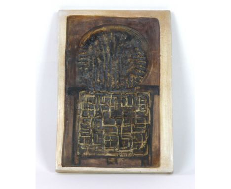 A Troika St Ives pottery Stove wall plaque
Relief decorated with a stylised circle above many intertwined squares, blue paint