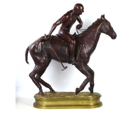 A substantial painted spelter figure of a polo player on horseback, 20th Century 
Depicting a polo player with his stick abou