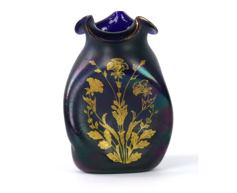 A Fine quality iridescent glass vase in the manner of Steuben 
Having gilt floral decoration on a twisted dimple shaped bottl