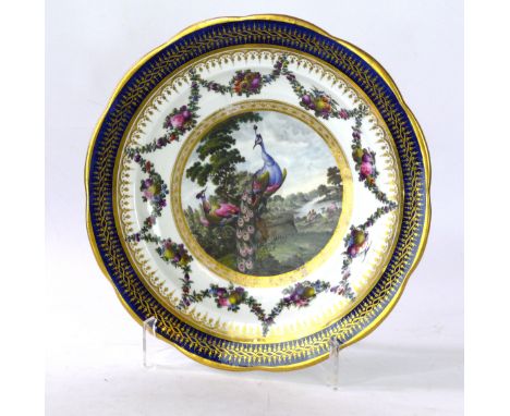 A Chamberlain's Worcester dessert plate, painted by George Davis, circa 1790 Of scalloped circular form, the central cartouch